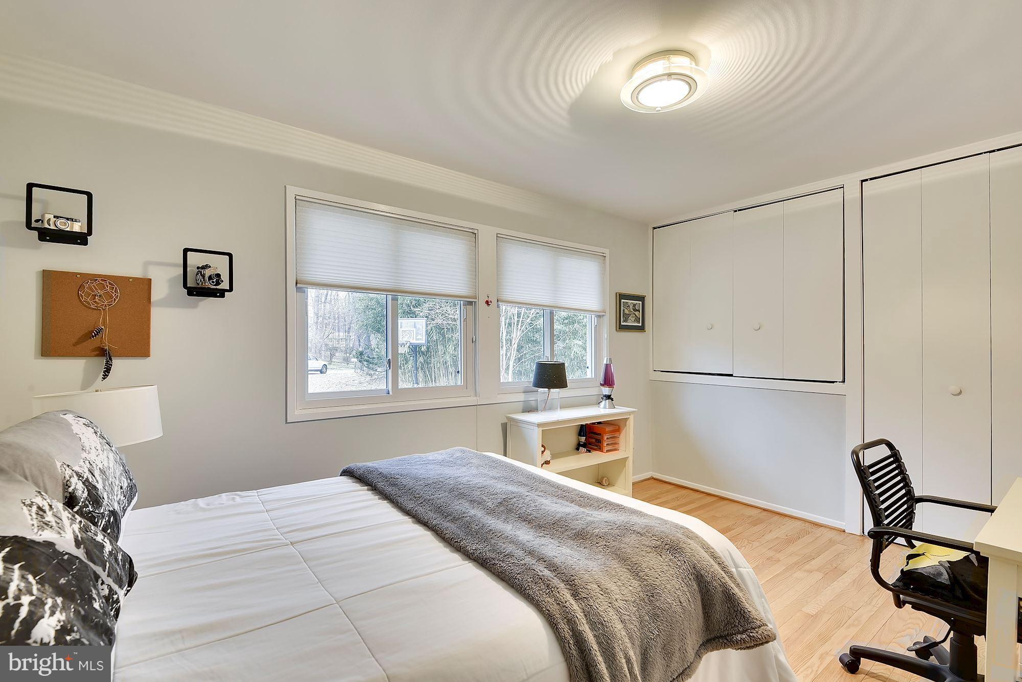 7600 Hamilton Spring Road Bethesda, MD 20817 - Photo 12 of 24 a bedroom with a bed and a window