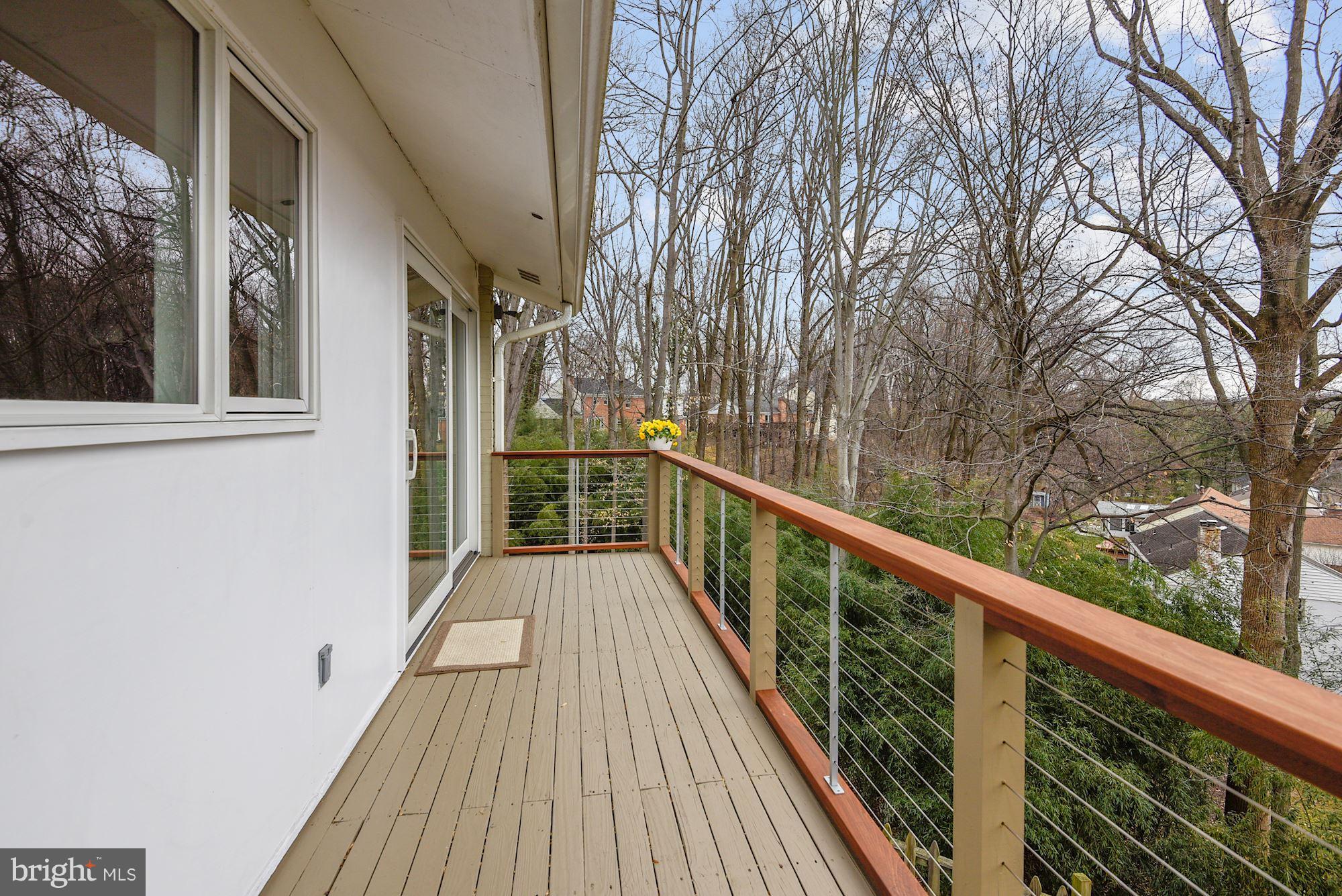 7600 Hamilton Spring Road Bethesda, MD 20817 - Photo 21 of 24 a view of balcony with wooden floor and fence