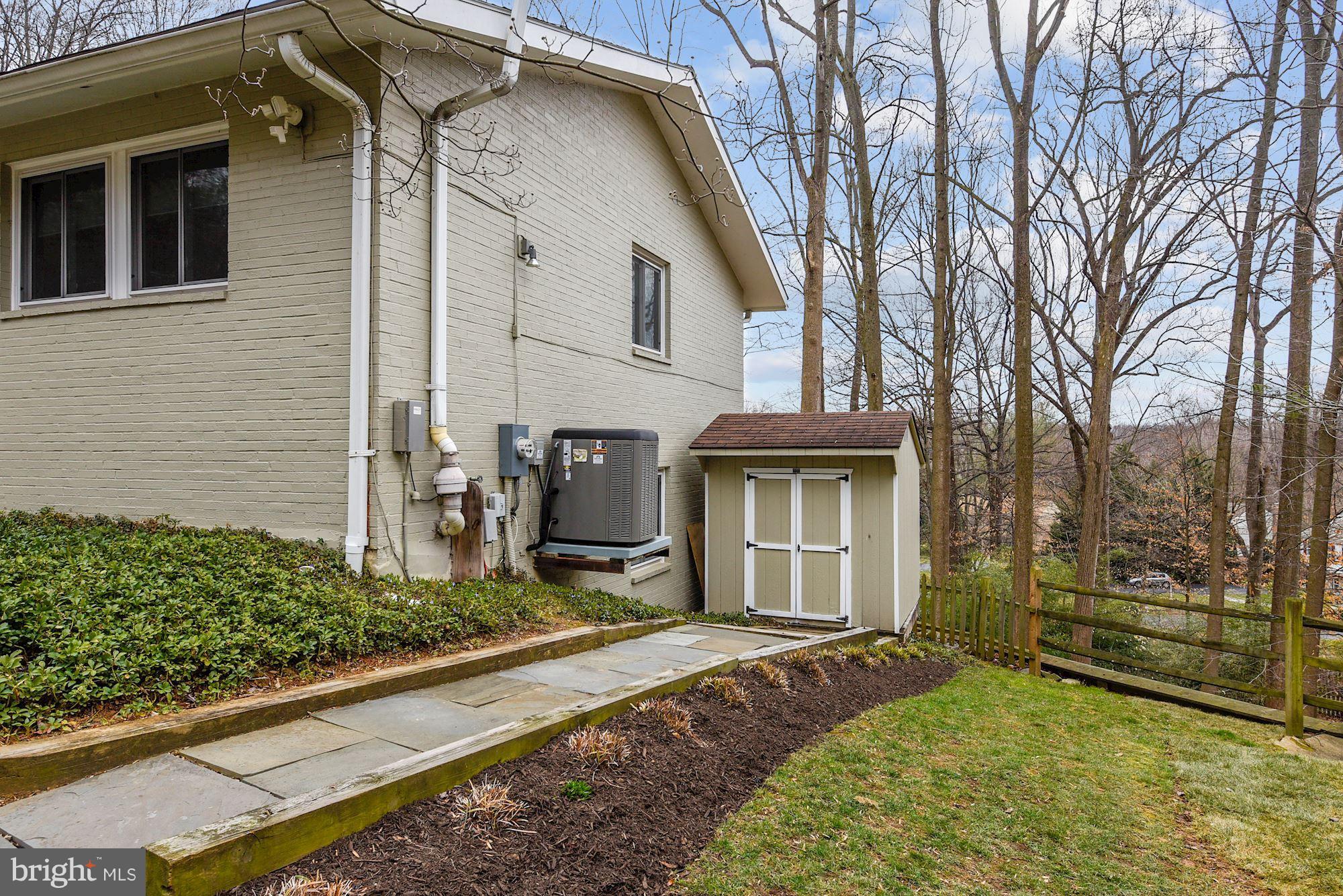 7600 Hamilton Spring Road Bethesda, MD 20817 - Photo 22 of 24 a view of a house with a yard