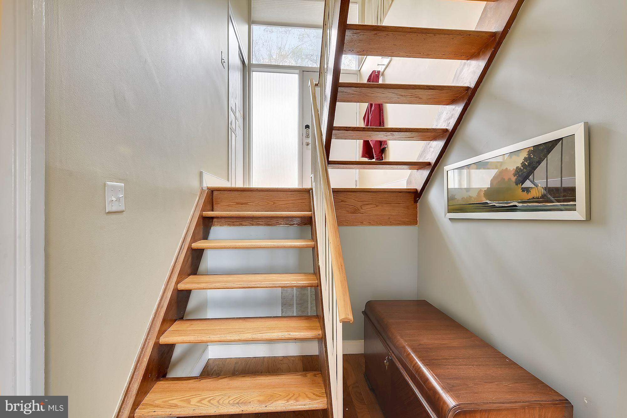 7600 Hamilton Spring Road Bethesda, MD 20817 - Photo 5 of 24 a view of staircase with white walls and a window