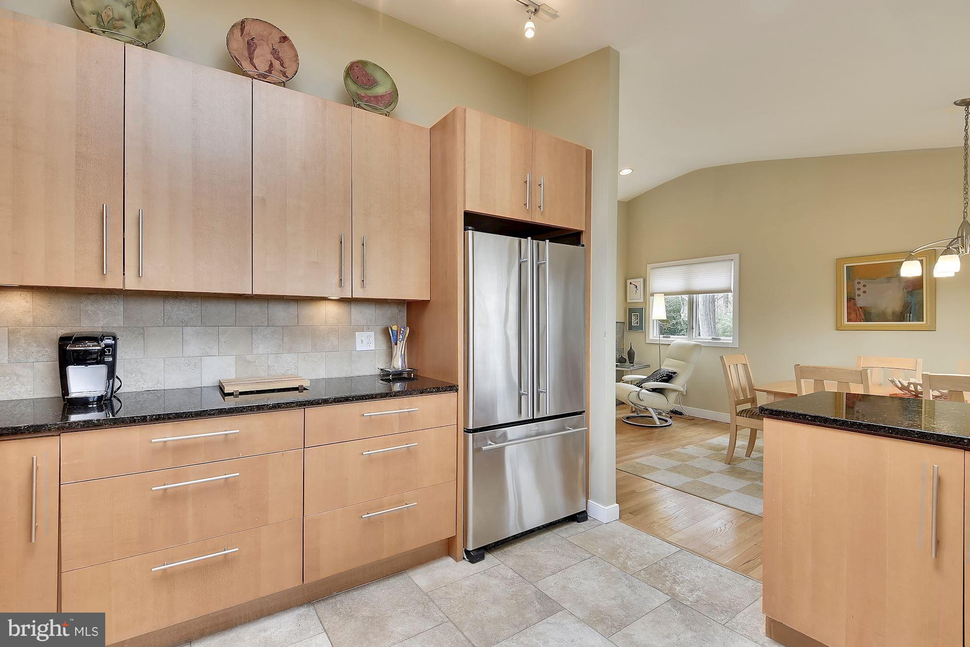 7600 Hamilton Spring Road Bethesda, MD 20817 - Photo 6 of 24 a kitchen with stainless steel appliances granite countertop a refrigerator a stove and a sink