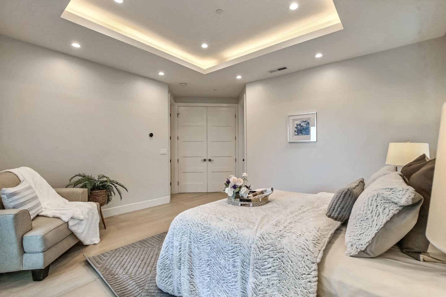 10047 Crescent Road Cupertino, CA 95014 - Photo 29 of 43 a bedroom with a bed and a couch