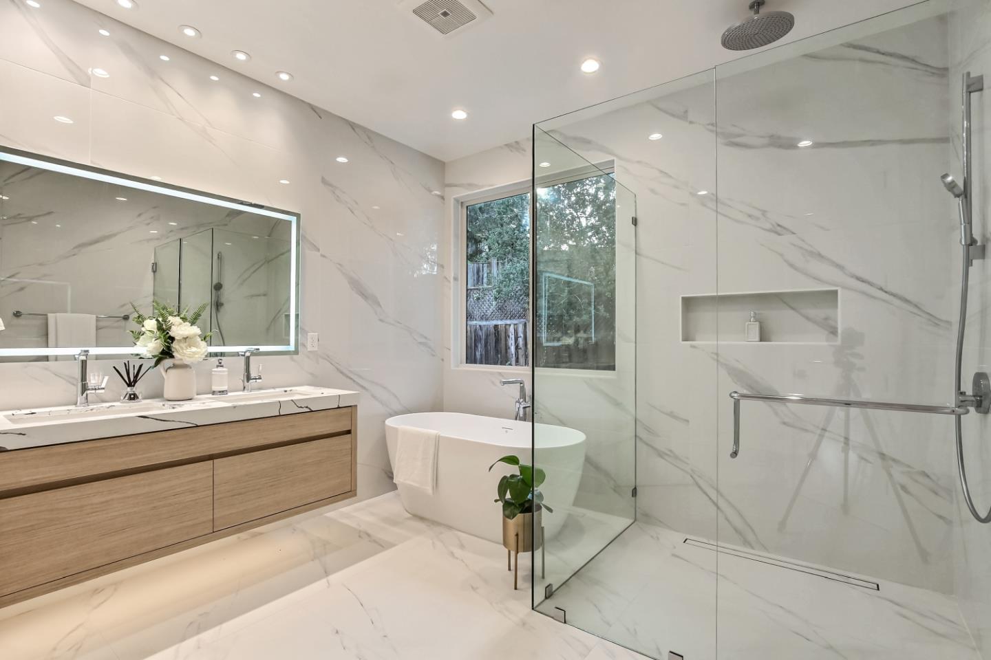 10047 Crescent Road Cupertino, CA 95014 - Photo 32 of 43 a bathroom with a double vanity sink and a bathtub