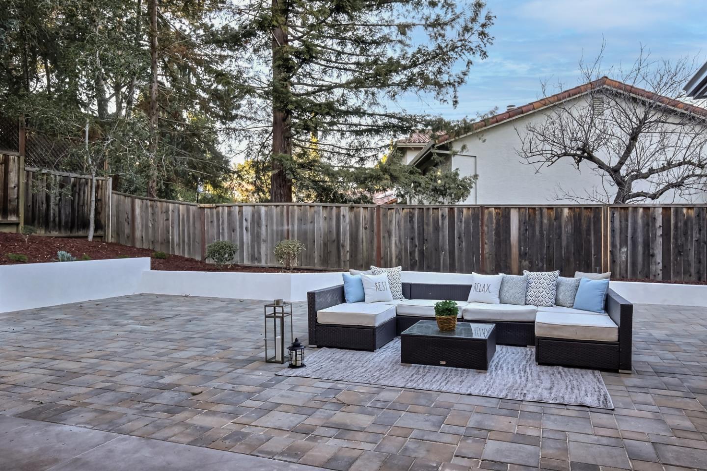 10047 Crescent Road Cupertino, CA 95014 - Photo 34 of 43 a patio with patio a couch and wooden fence