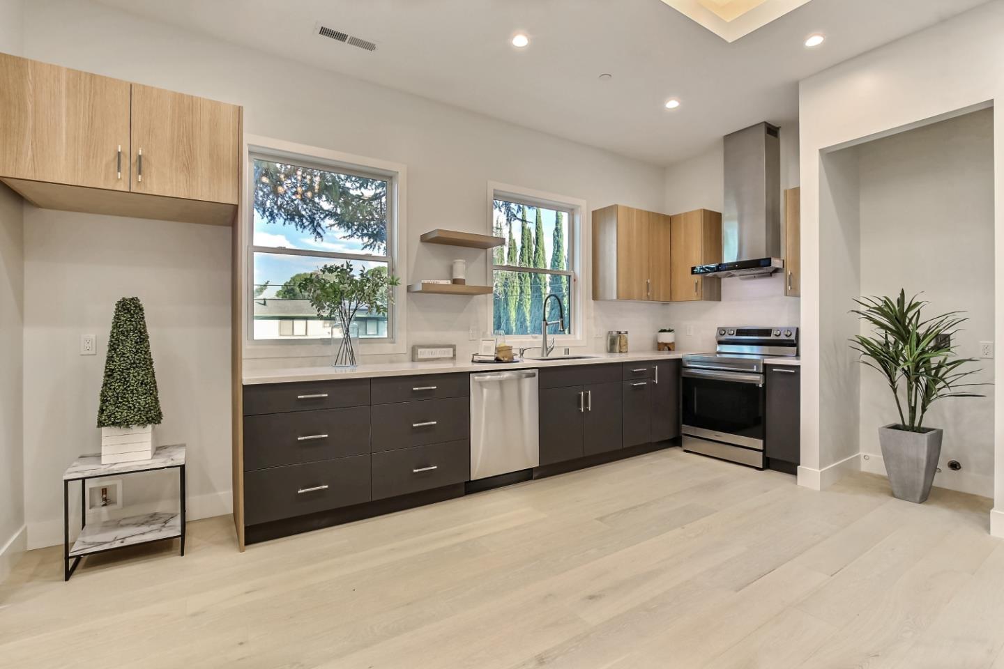 10047 Crescent Road Cupertino, CA 95014 - Photo 36 of 43 a kitchen with stainless steel appliances a sink and a refrigerator