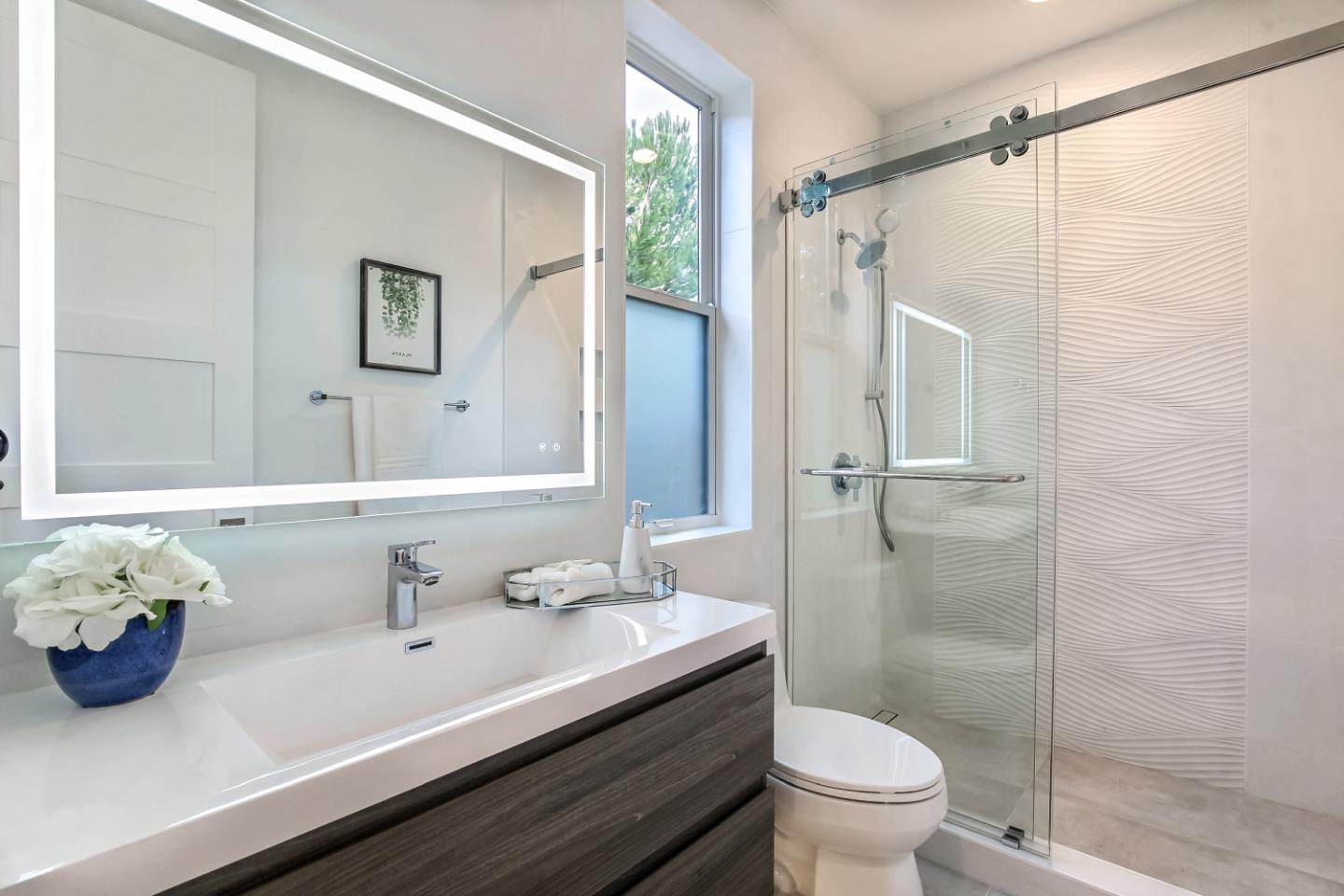 10047 Crescent Road Cupertino, CA 95014 - Photo 39 of 43 a bathroom with a sink toilet and shower