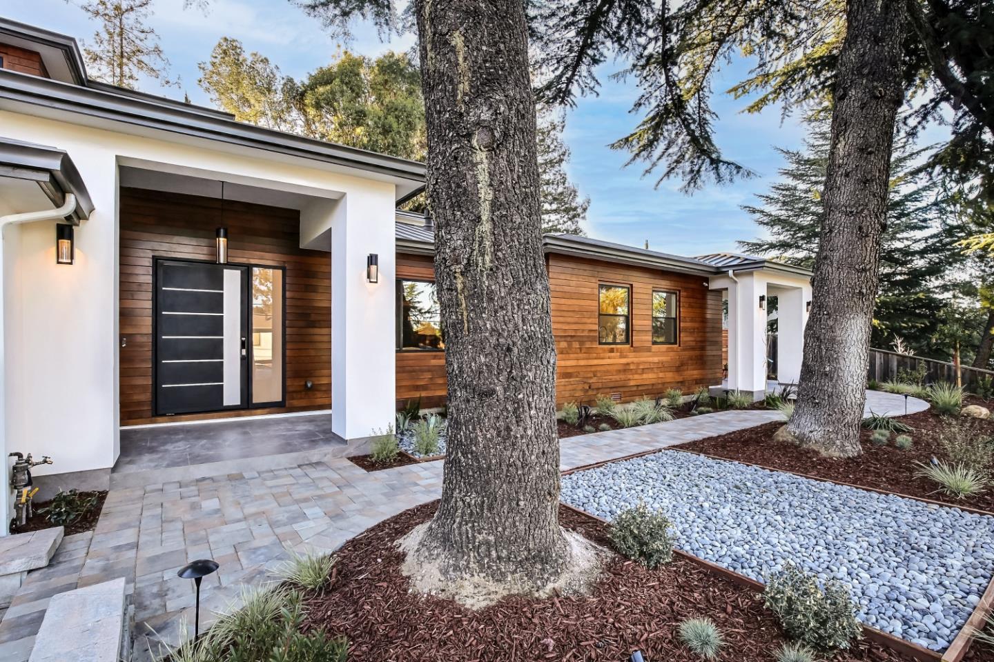 10047 Crescent Road Cupertino, CA 95014 - Photo 4 of 43 a front view of a house with garden