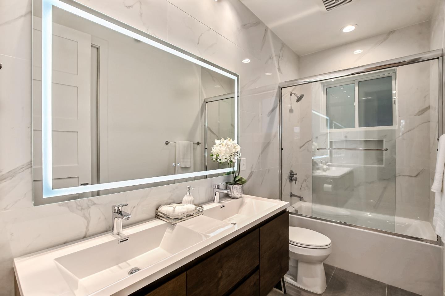 10047 Crescent Road Cupertino, CA 95014 - Photo 41 of 43 a bathroom with a sink a toilet and shower