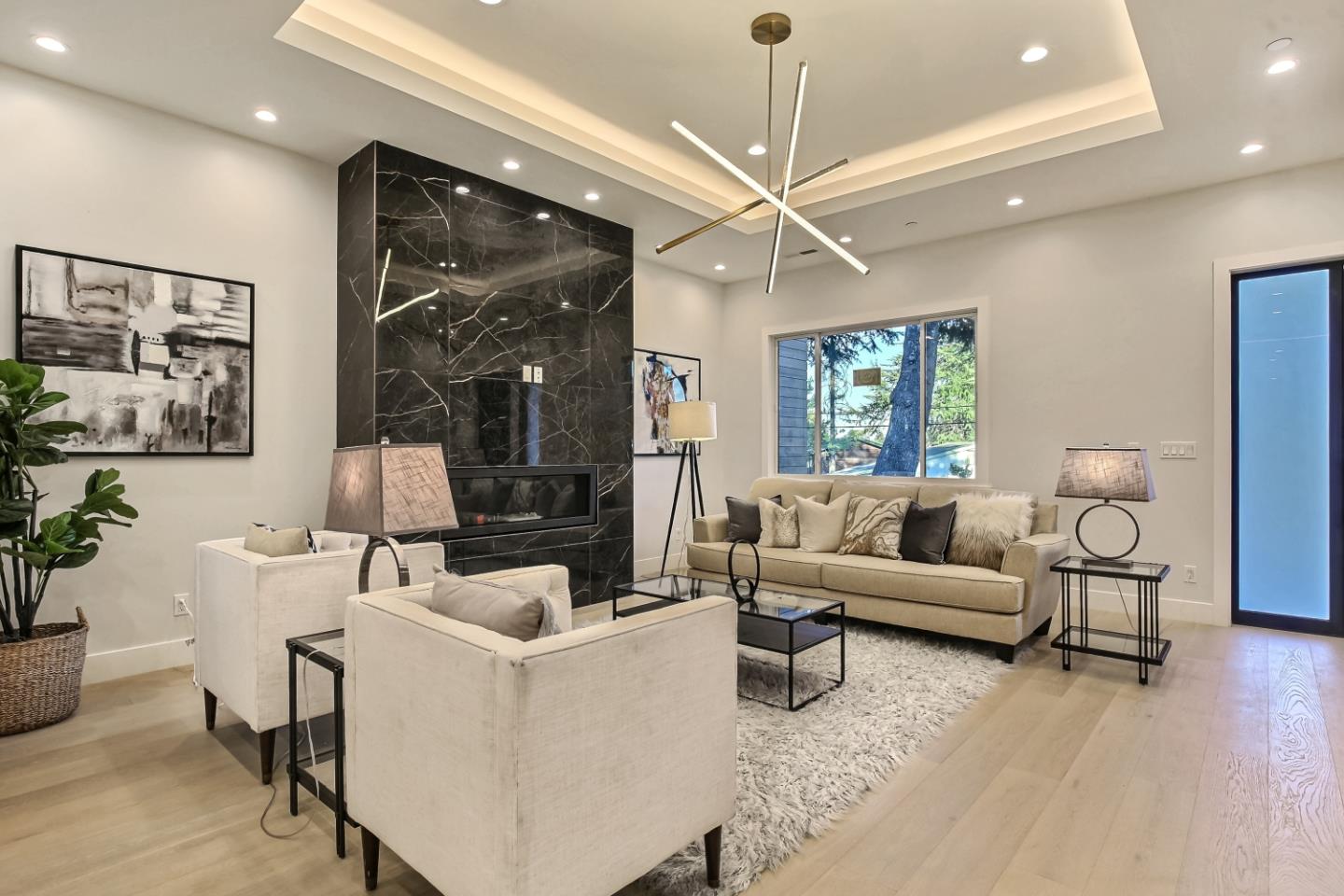 10047 Crescent Road Cupertino, CA 95014 - Photo 5 of 43 a living room with furniture and a large window