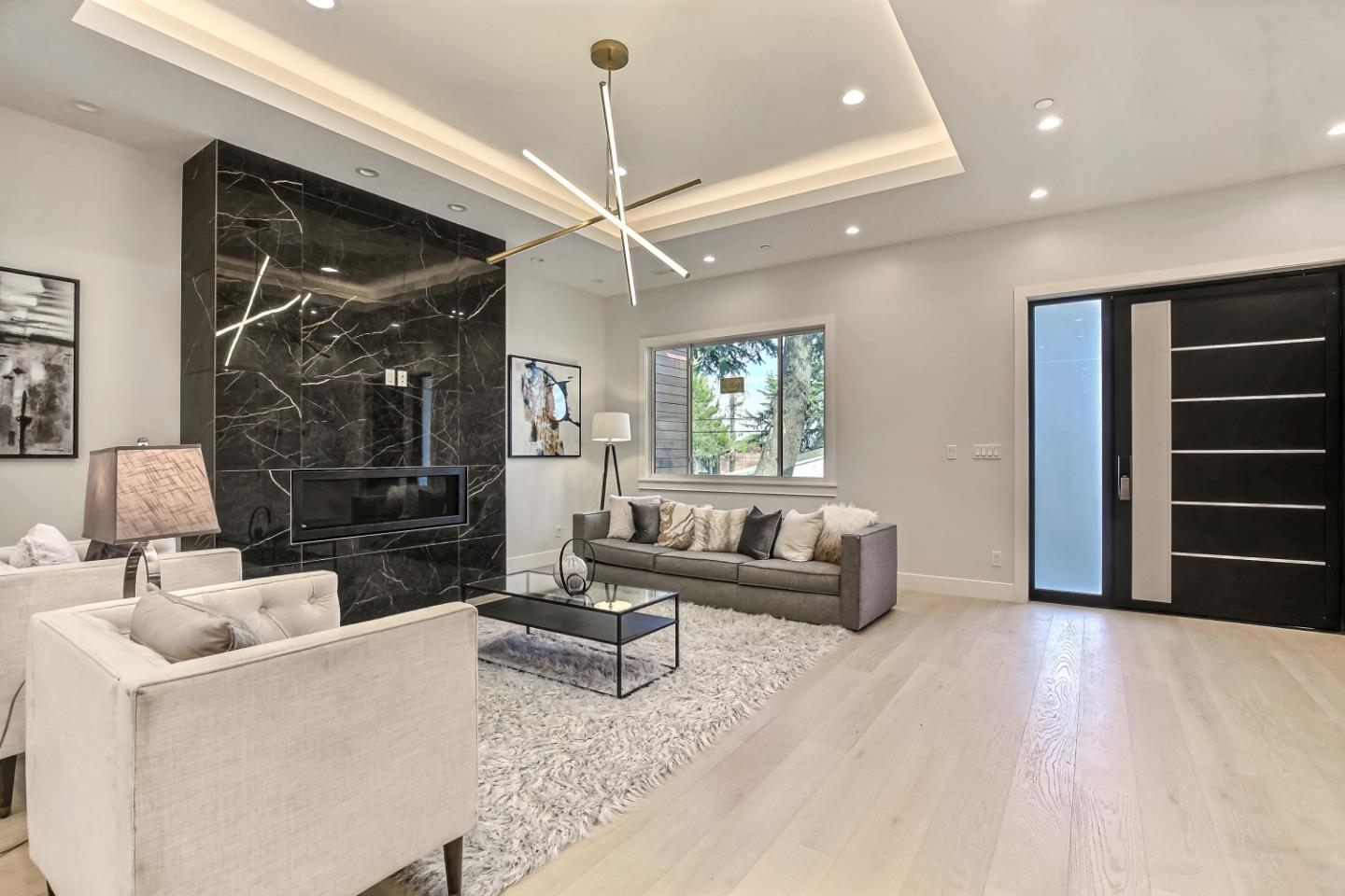 10047 Crescent Road Cupertino, CA 95014 - Photo 6 of 43 a living room with furniture and a chandelier
