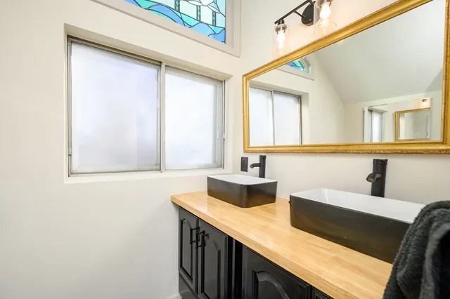 a bathroom with a sink and a mirror