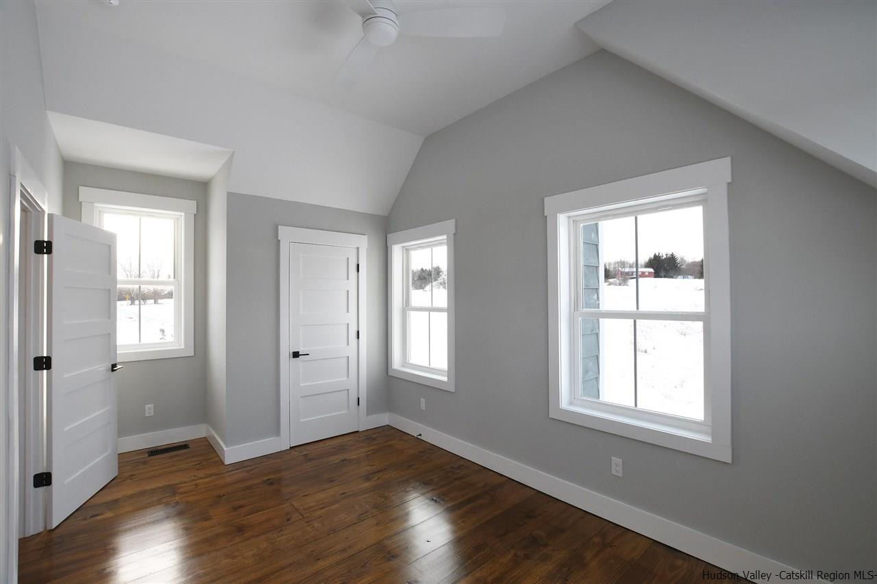 460 County Road Callicoon, NY 12723 - Photo 19 of 33 an empty room with wooden floor and windows