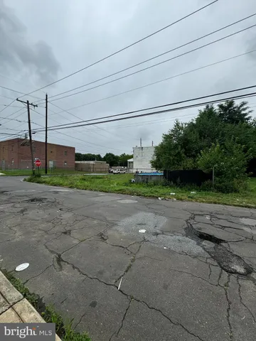 a backyard of a house with a yard and outdoor seating