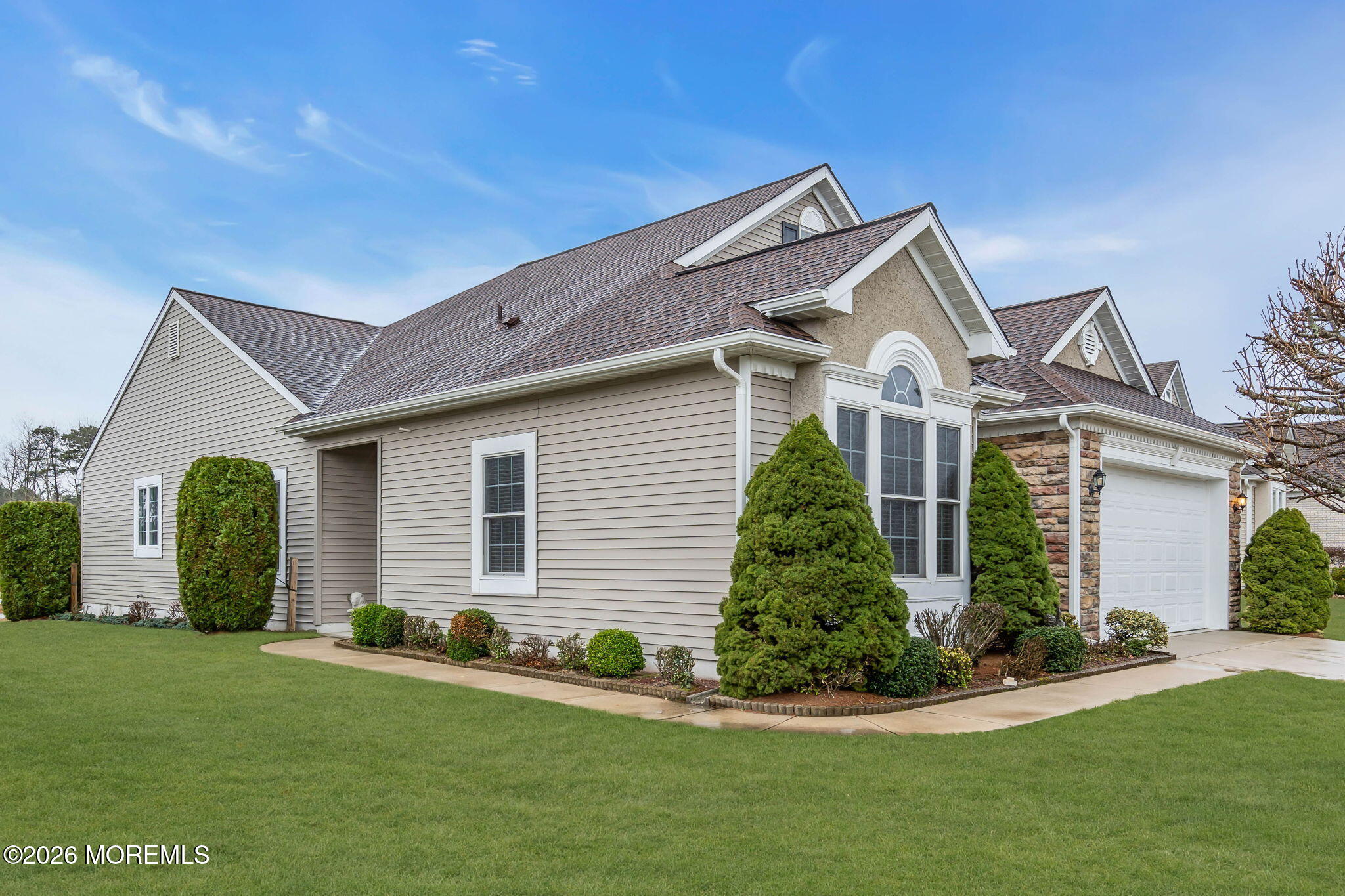 46 Pancoast Road Waretown, NJ 08758 - Photo 2 of 55 a front view of a house with a garden and plants