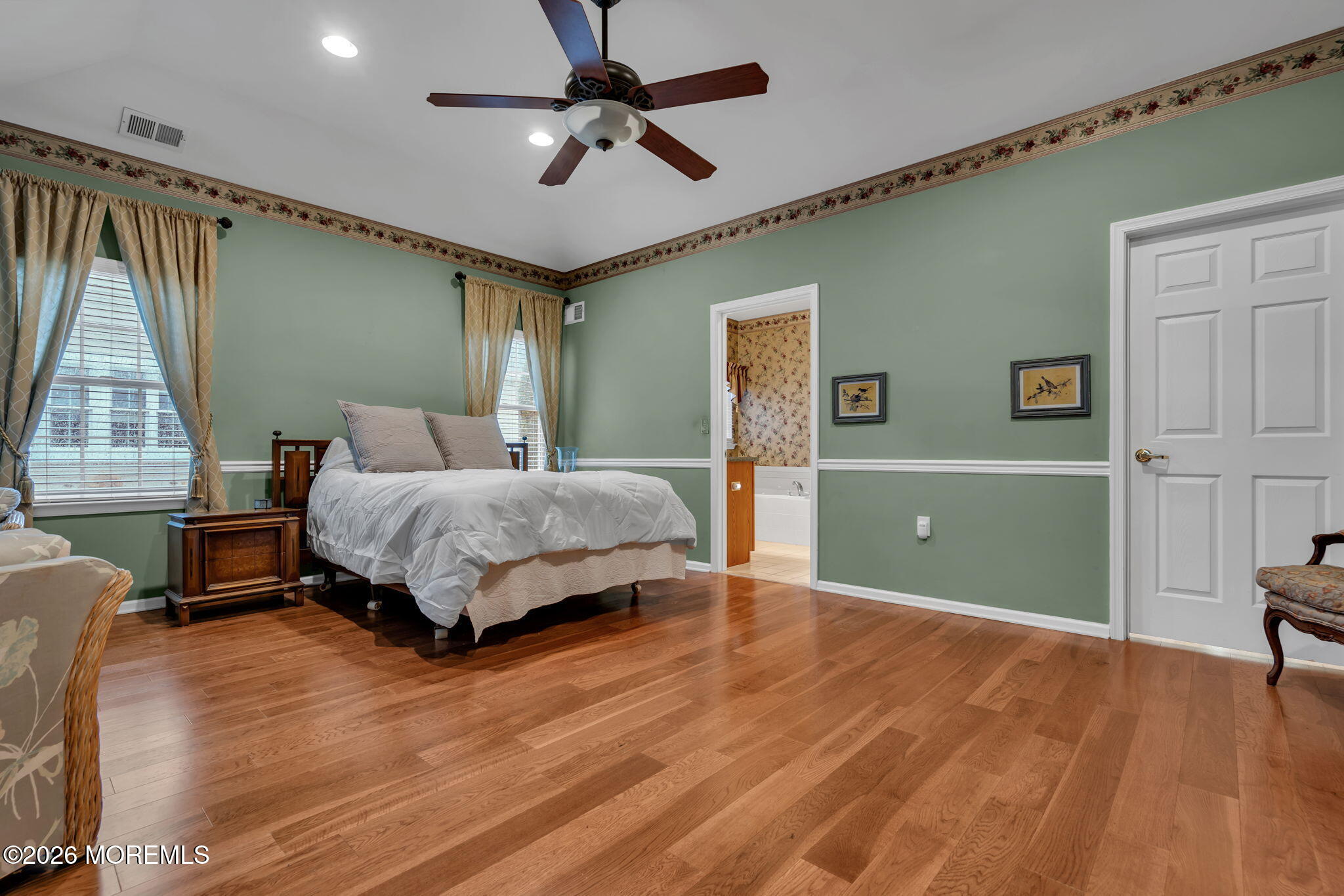 46 Pancoast Road Waretown, NJ 08758 - Photo 23 of 55 a bedroom with a bed and a chandelier