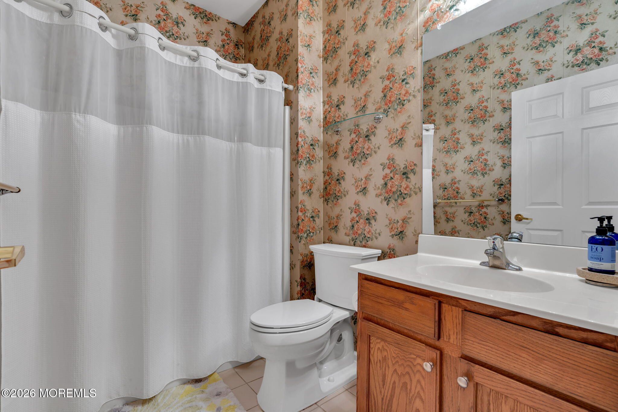 46 Pancoast Road Waretown, NJ 08758 - Photo 31 of 55 a bathroom with a sink a toilet and shower curtain