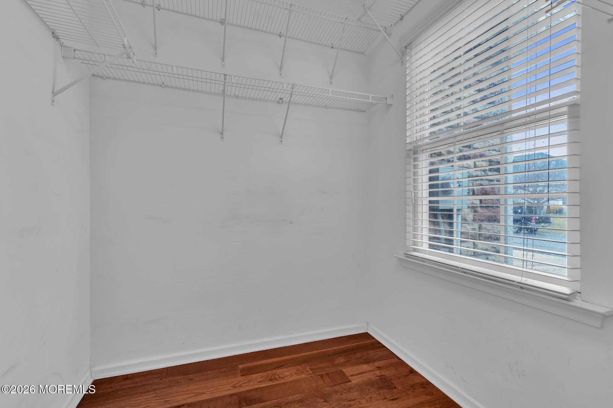 46 Pancoast Road Waretown, NJ 08758 - Photo 32 of 55 a view of a small space with wooden floor and a window