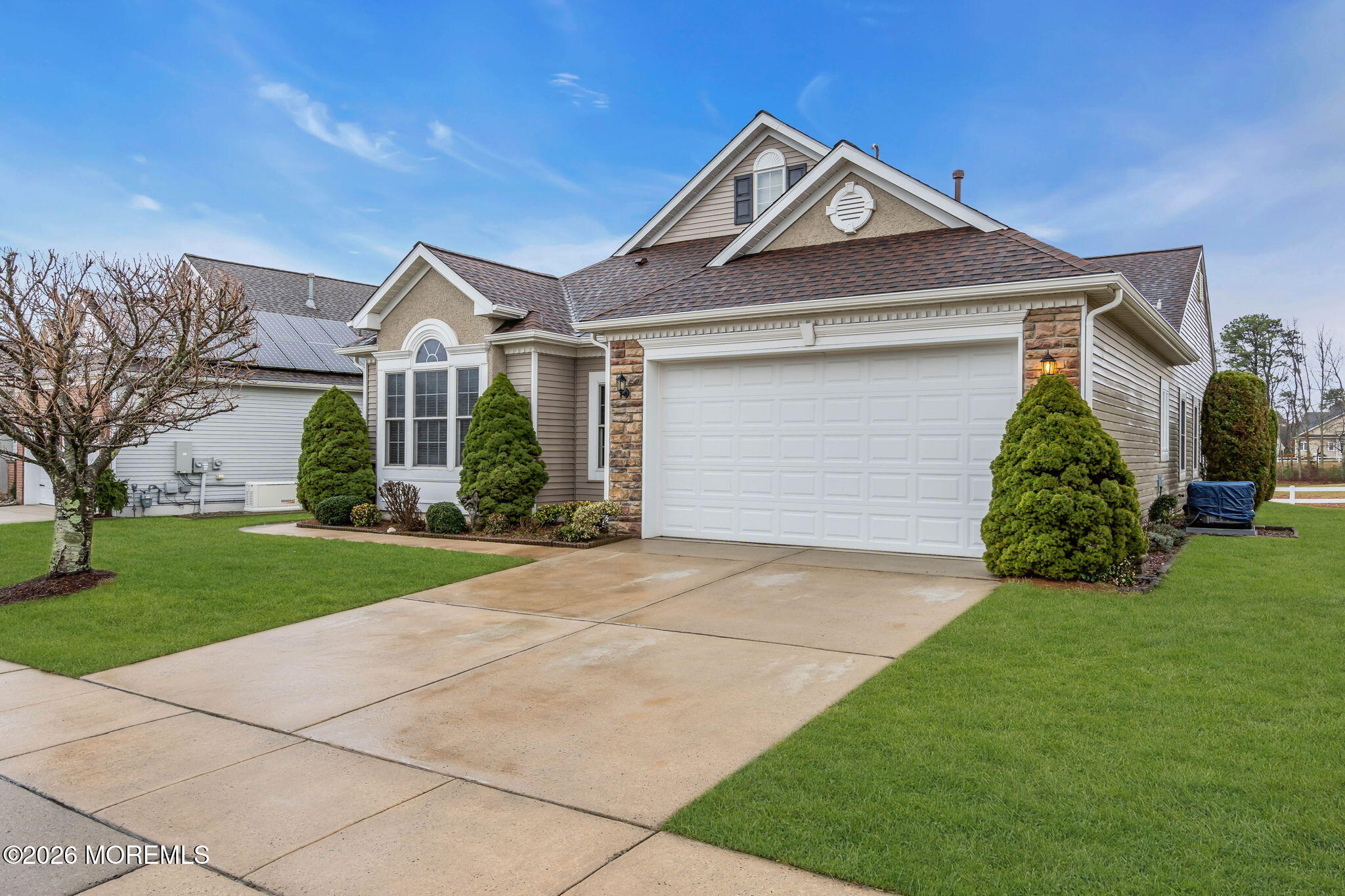 46 Pancoast Road Waretown, NJ 08758 - Photo 37 of 55 a front view of a house with a yard and garage