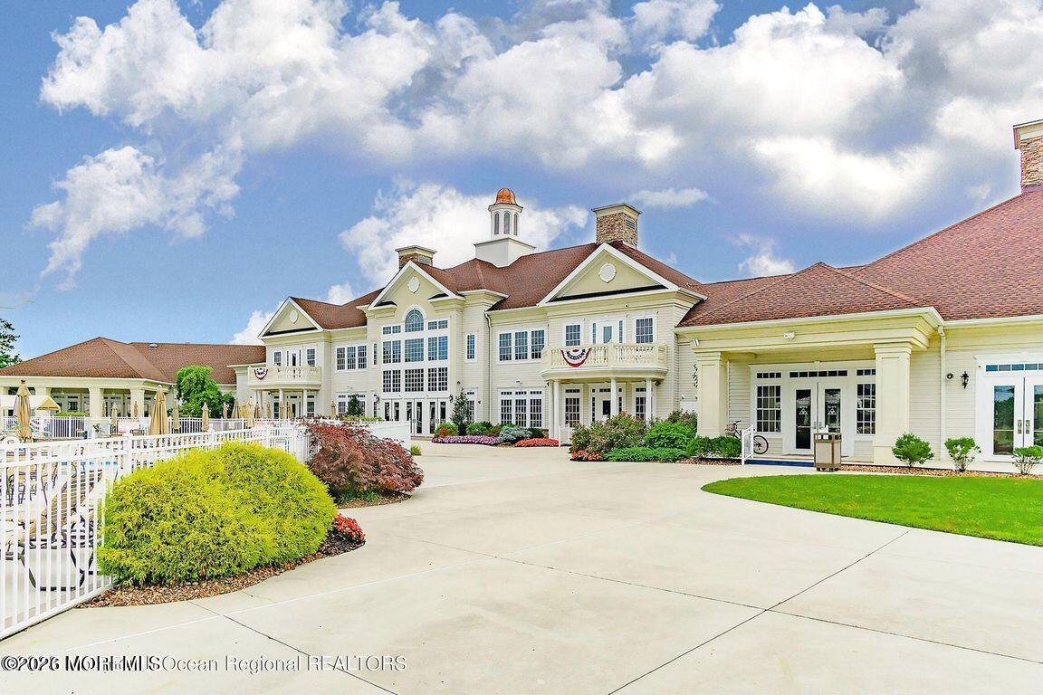 46 Pancoast Road Waretown, NJ 08758 - Photo 44 of 55 a view of a white house with a big yard and potted plants