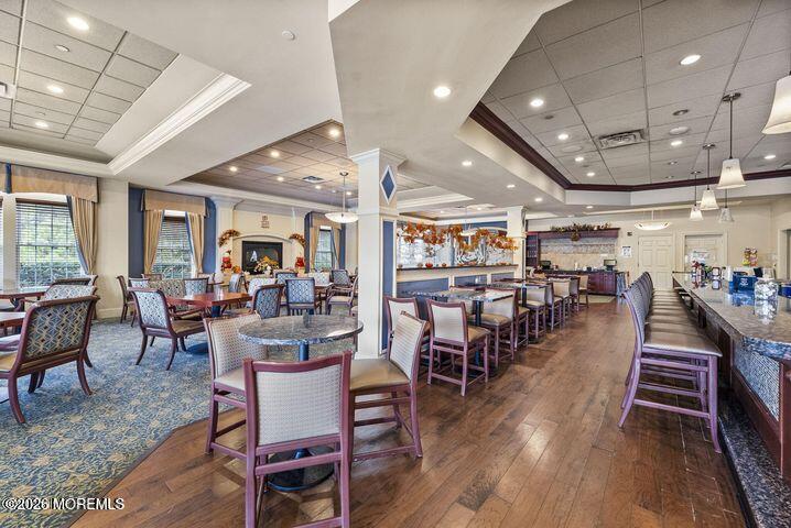 46 Pancoast Road Waretown, NJ 08758 - Photo 48 of 55 a dining room with lots of furniture and wooden floor