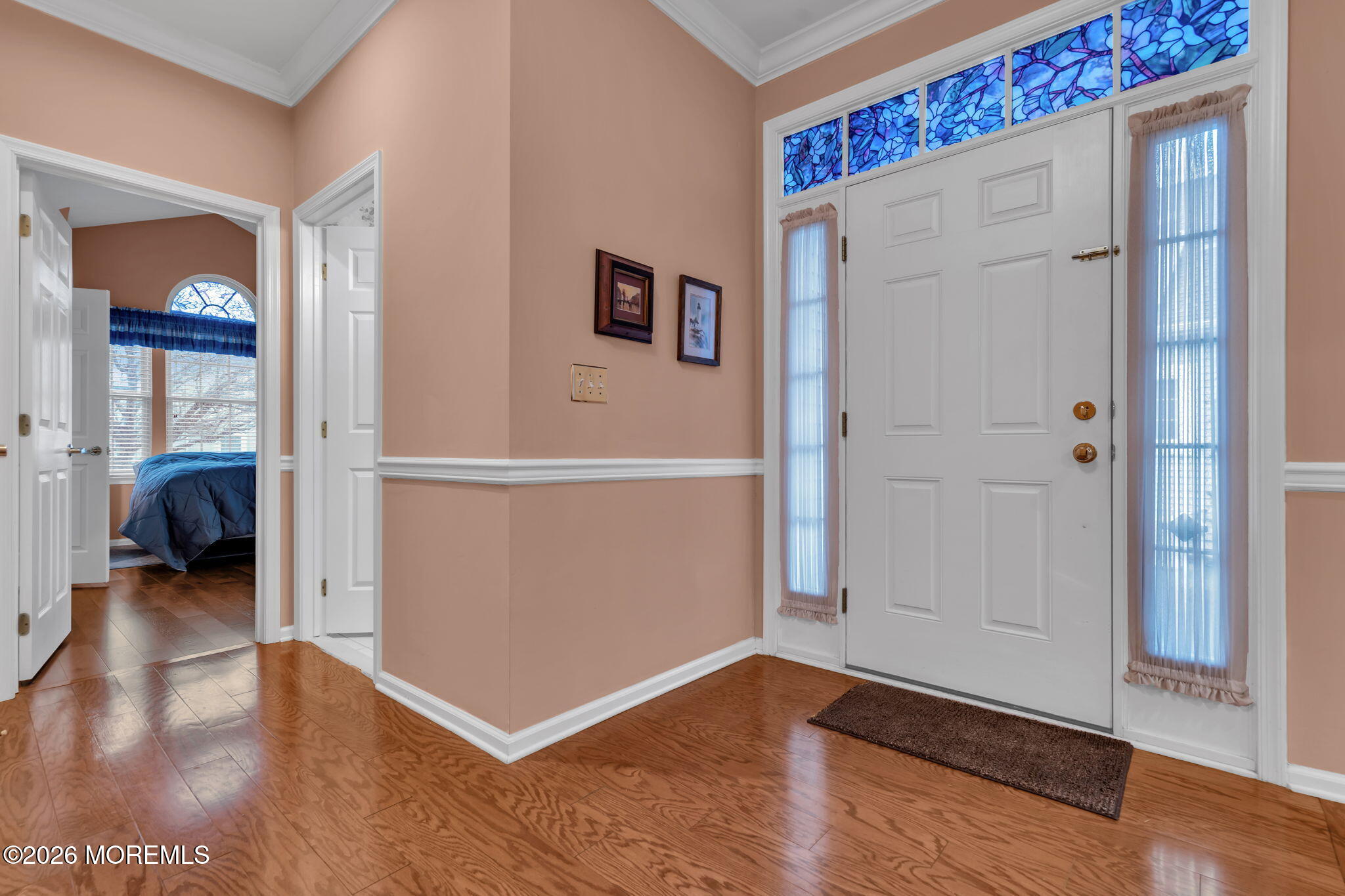 46 Pancoast Road Waretown, NJ 08758 - Photo 6 of 55 a view of a hallway with wooden floor and a living room