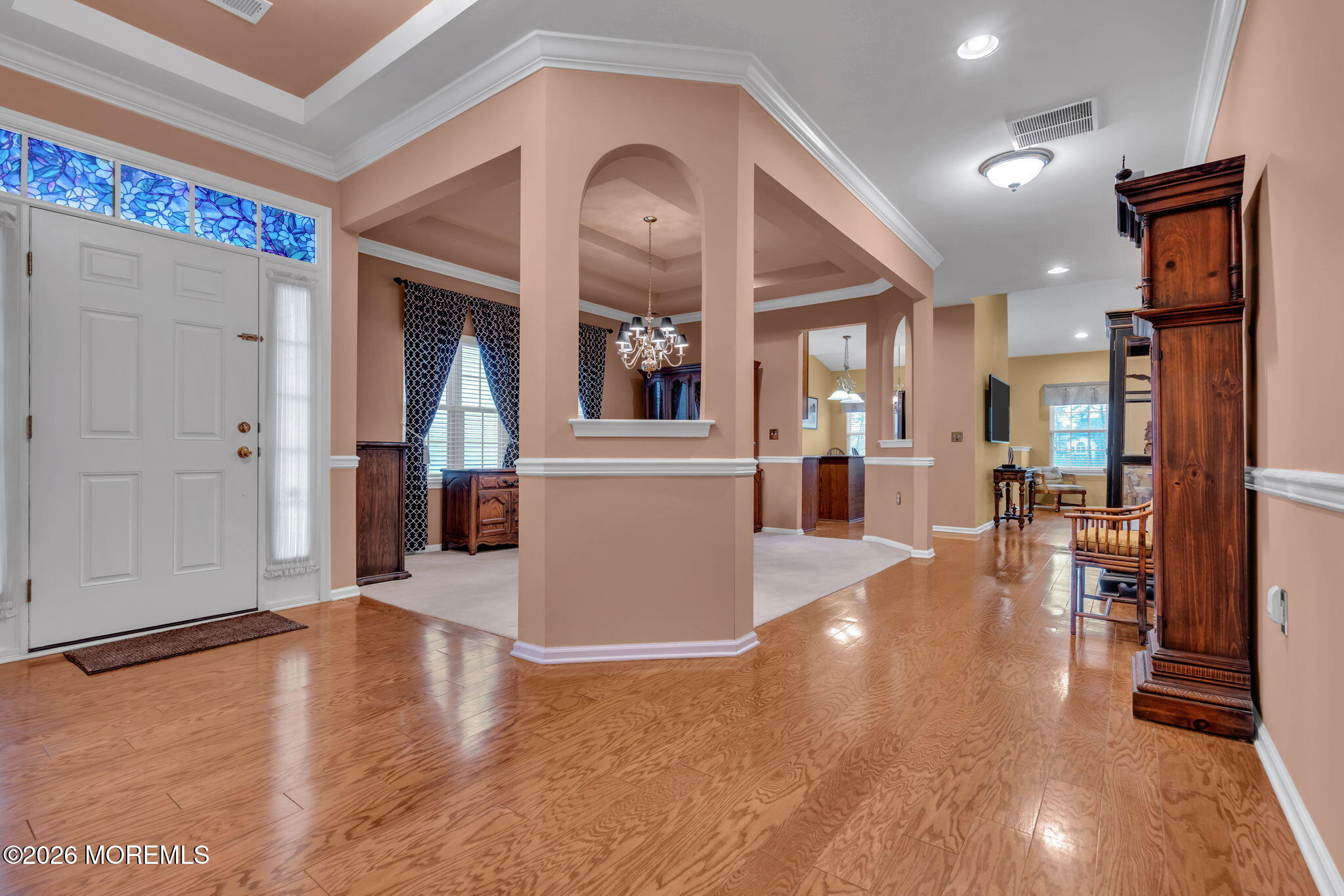 46 Pancoast Road Waretown, NJ 08758 - Photo 7 of 55 a view of a living room and kitchen with a flat screen tv