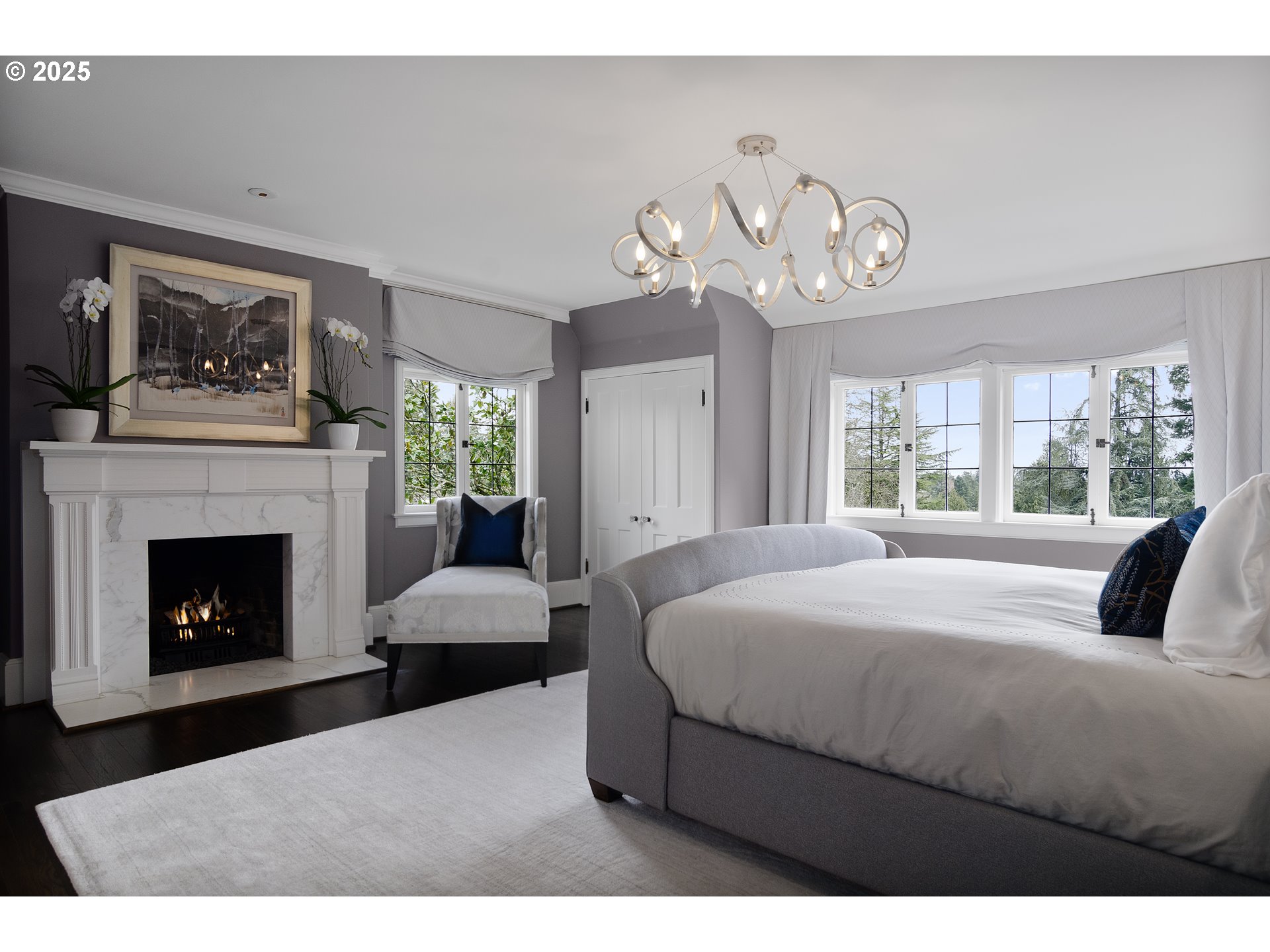 2624 Southwest Talbot Road Portland, OR 97201 - Photo 24 of 48 a bedroom with a large bed and a fireplace