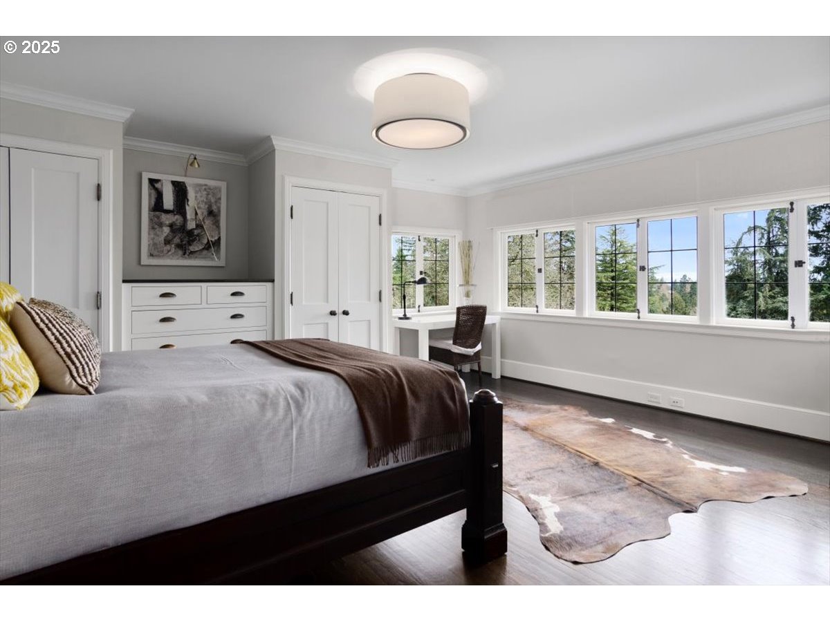 2624 Southwest Talbot Road Portland, OR 97201 - Photo 27 of 48 a bedroom with a bed and window