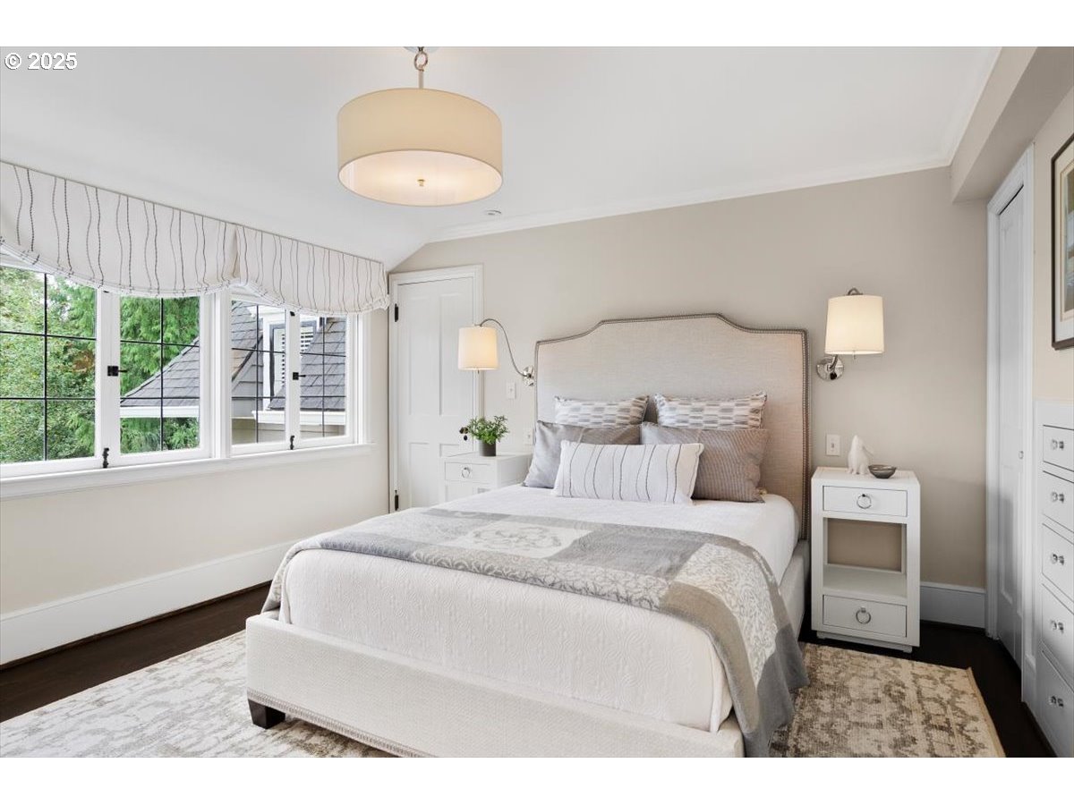 2624 Southwest Talbot Road Portland, OR 97201 - Photo 29 of 48 a bedroom with a large bed and a large window