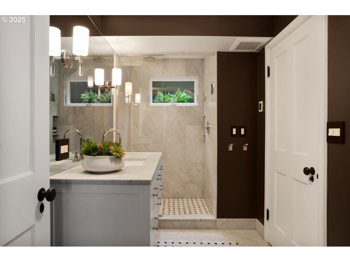 2624 Southwest Talbot Road Portland, OR 97201 - Photo 34 of 48 a bathroom with a sink and a mirror