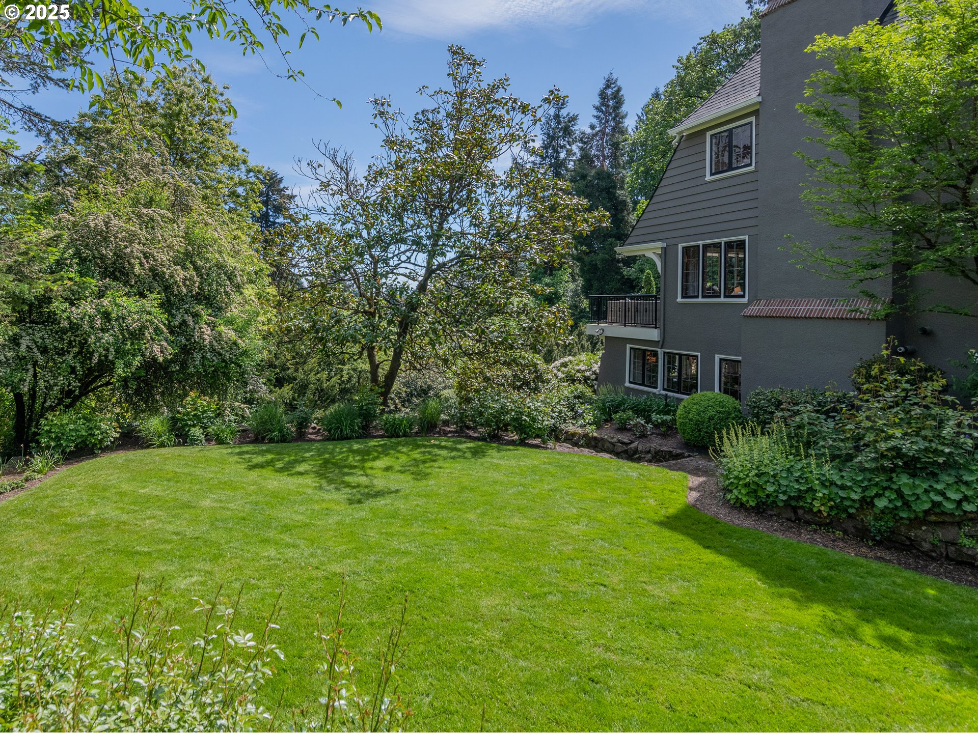 2624 Southwest Talbot Road Portland, OR 97201 - Photo 40 of 48 a view of a big yard with plants and large trees