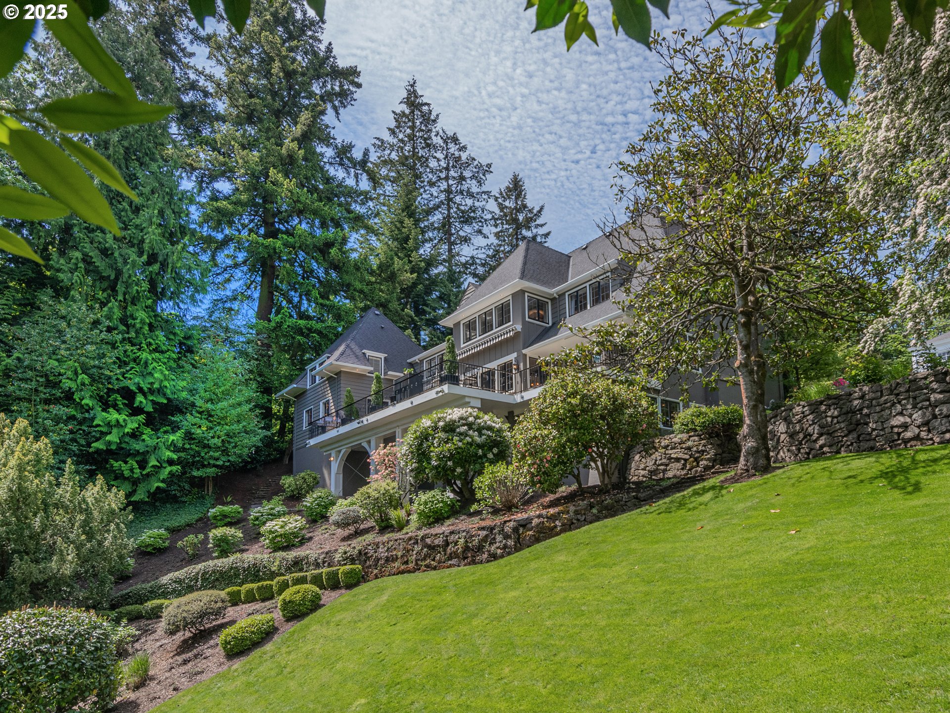 2624 Southwest Talbot Road Portland, OR 97201 - Photo 41 of 48 a view of a garden with a house in the background