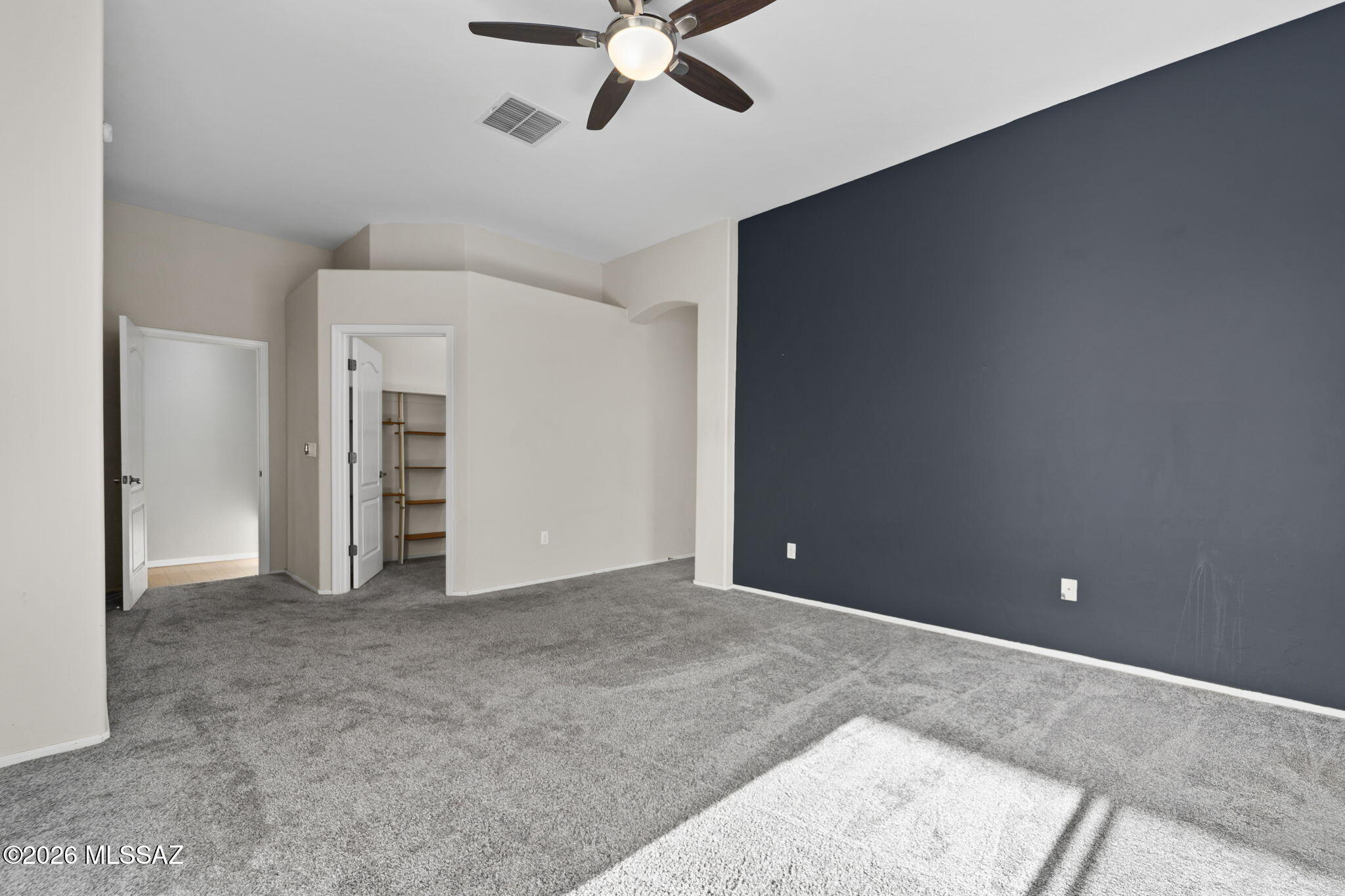 13668 East High Plains Ranch Street Vail, AZ 85641 - Photo 27 of 51 an empty room with closet and windows