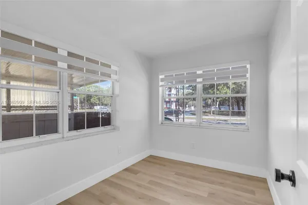 a view of an empty room with a window