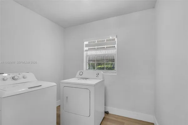 a utility room with dryer and washer