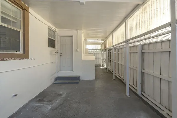 a view of a porch with wooden floor and stairs
