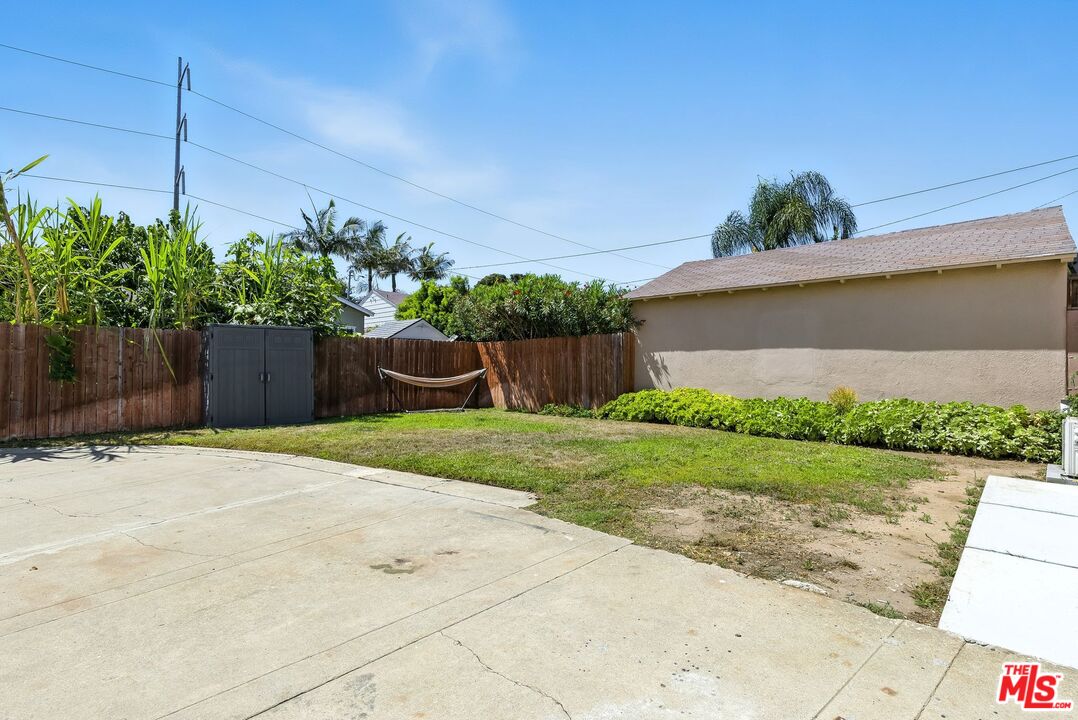237 West Kelso Street, Unit 237 1/2 Inglewood, CA 90301 - Photo 11 of 13 a front view of a house with a yard