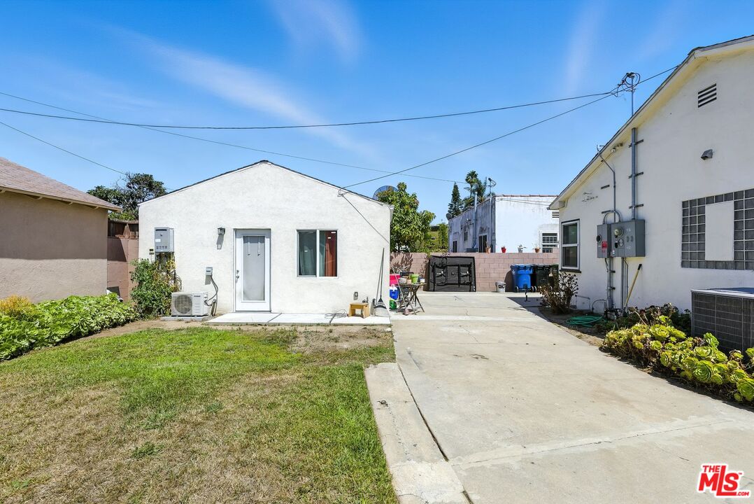237 West Kelso Street, Unit 237 1/2 Inglewood, CA 90301 - Photo 13 of 13 a front view of a house with a yard