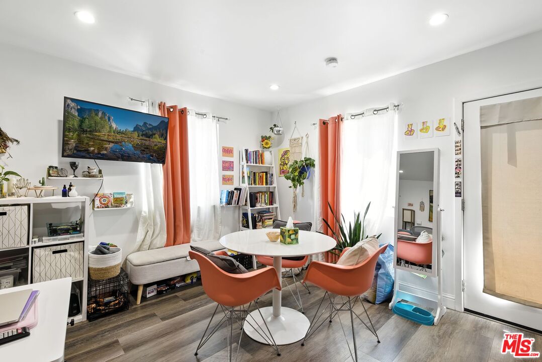 237 West Kelso Street, Unit 237 1/2 Inglewood, CA 90301 - Photo 3 of 13 a living room with furniture and a flat screen tv