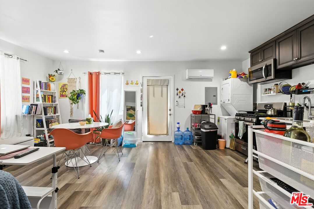 237 West Kelso Street, Unit 237 1/2 Inglewood, CA 90301 - Photo 10 of 13 a living room with furniture and a flat screen tv