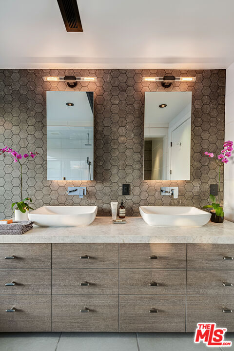 2715 Edwin Place Los Angeles, CA 90046 - Photo 23 of 52 a bathroom with a granite countertop sink and a mirror