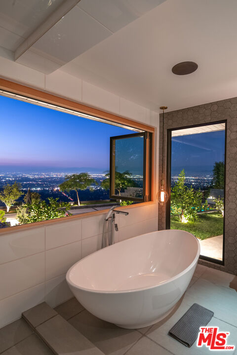 2715 Edwin Place Los Angeles, CA 90046 - Photo 26 of 52 a bathroom with a sink and a large window