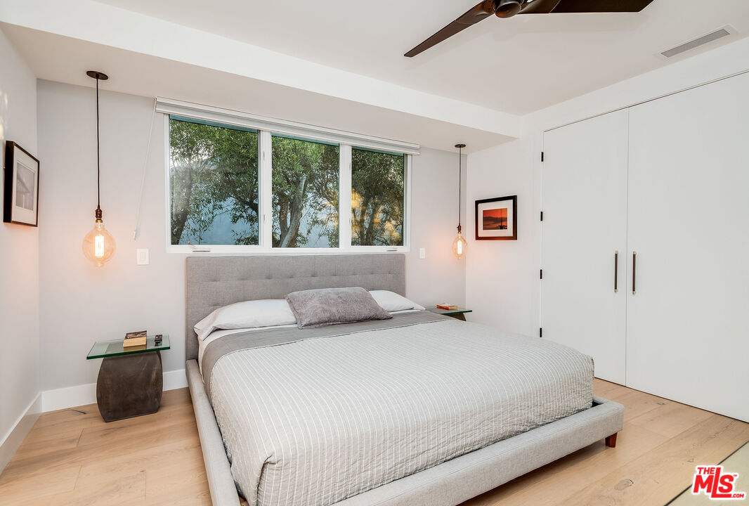 2715 Edwin Place Los Angeles, CA 90046 - Photo 28 of 52 a bedroom with a bed and a large window