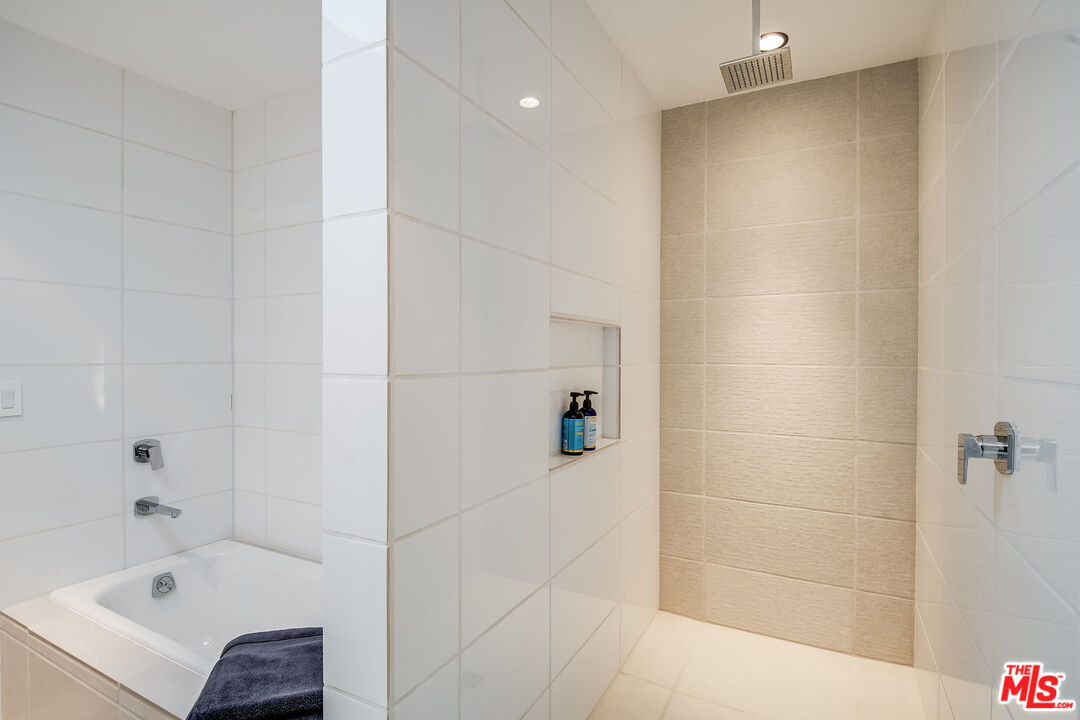 2715 Edwin Place Los Angeles, CA 90046 - Photo 29 of 52 a bathroom with a bathtub and shower