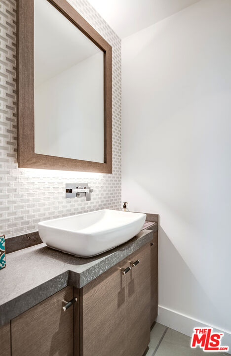 2715 Edwin Place Los Angeles, CA 90046 - Photo 30 of 52 a bathroom with a sink and a mirror