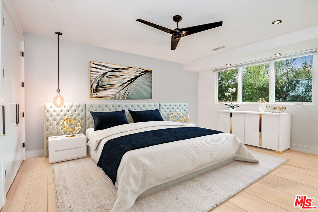 2715 Edwin Place Los Angeles, CA 90046 - Photo 31 of 52 a bedroom with a large bed and a large window