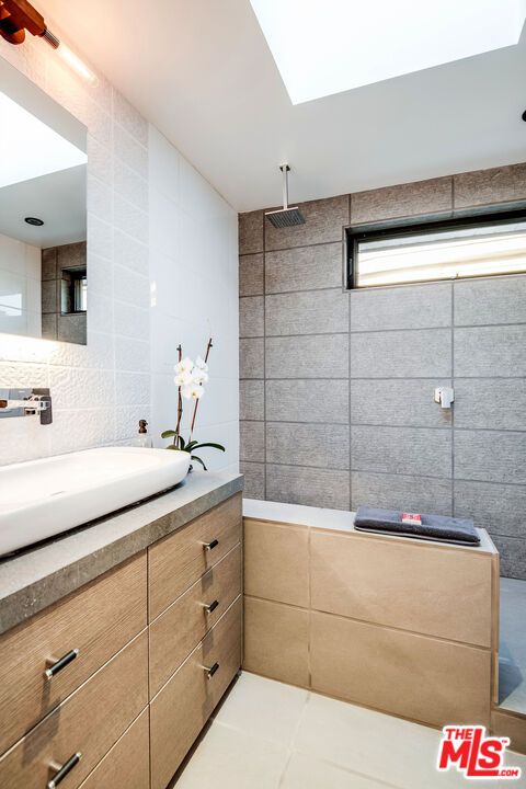 2715 Edwin Place Los Angeles, CA 90046 - Photo 35 of 52 a bathroom with a tub and sink