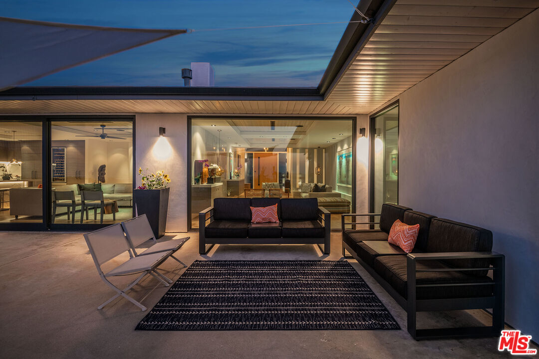 2715 Edwin Place Los Angeles, CA 90046 - Photo 37 of 52 a living room with furniture a rug and a chandelier