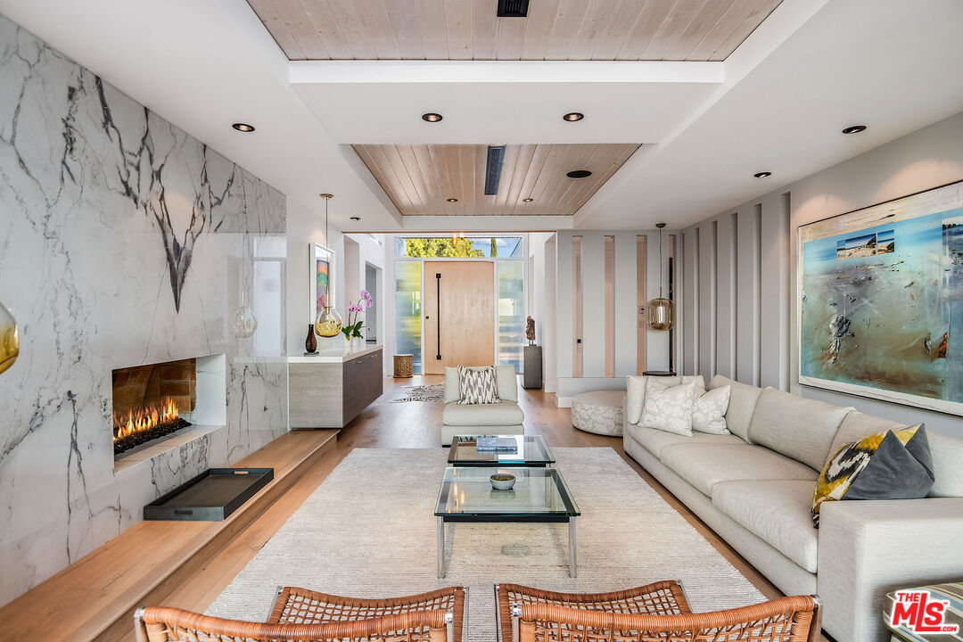 2715 Edwin Place Los Angeles, CA 90046 - Photo 10 of 52 a living room with furniture flat screen tv and a fireplace