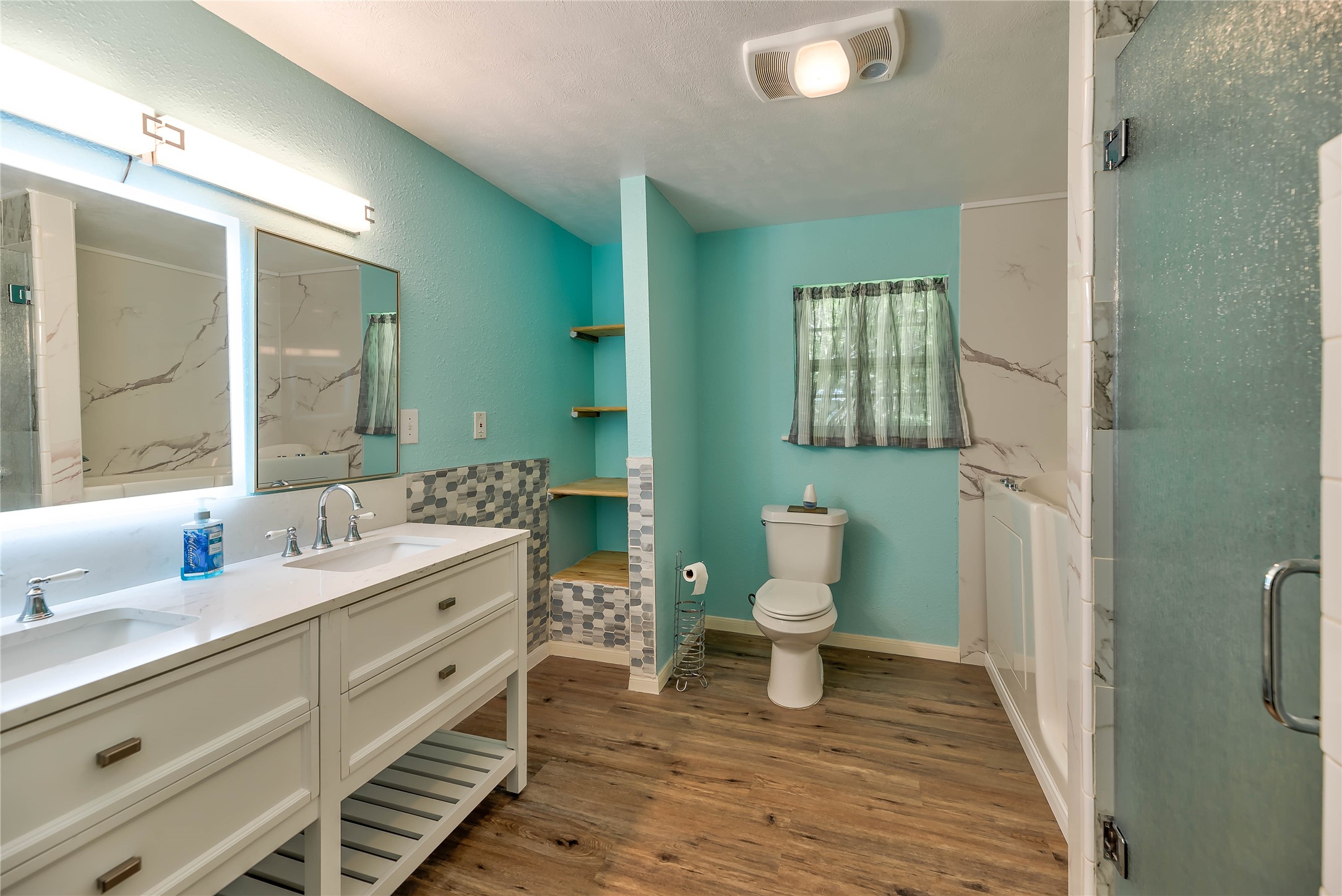 3003 Paul Knox Street Huntsville, TX 77320 - Photo 15 of 46 a bathroom with a toilet sink and mirror